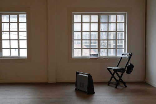 Wooden Chair in an Empty Room 