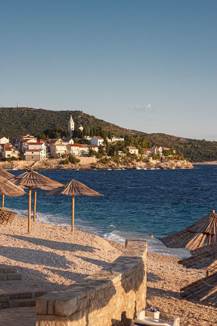Beautiful summer day at Primošten beach with scenic views of the Adriatic coastline.