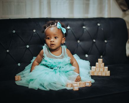Girl in Blue Tulle on Sofa