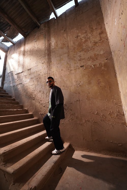 Man on Steps in Abandoned Space