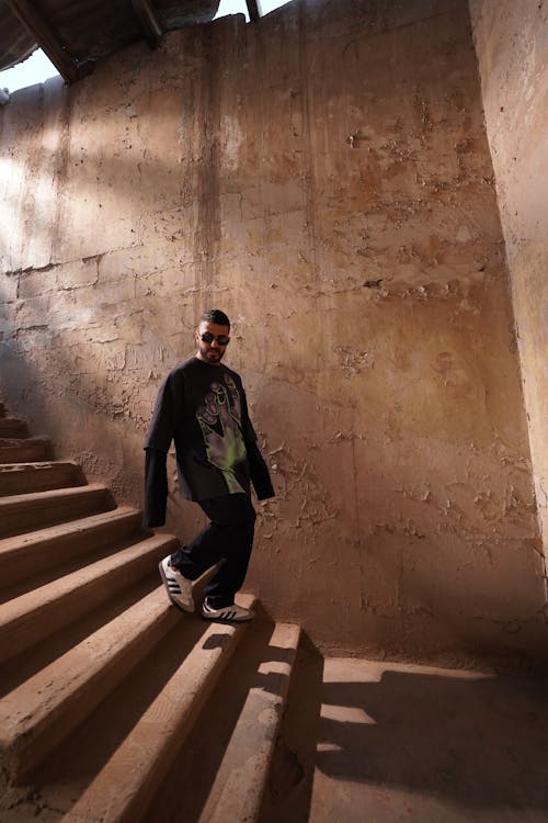 Man on Steps in Abandoned Site