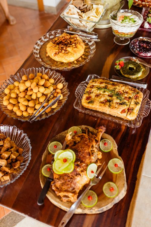 Free A vibrant spread of homemade savory dishes laid out on a wooden table for lunch. Stock Photo