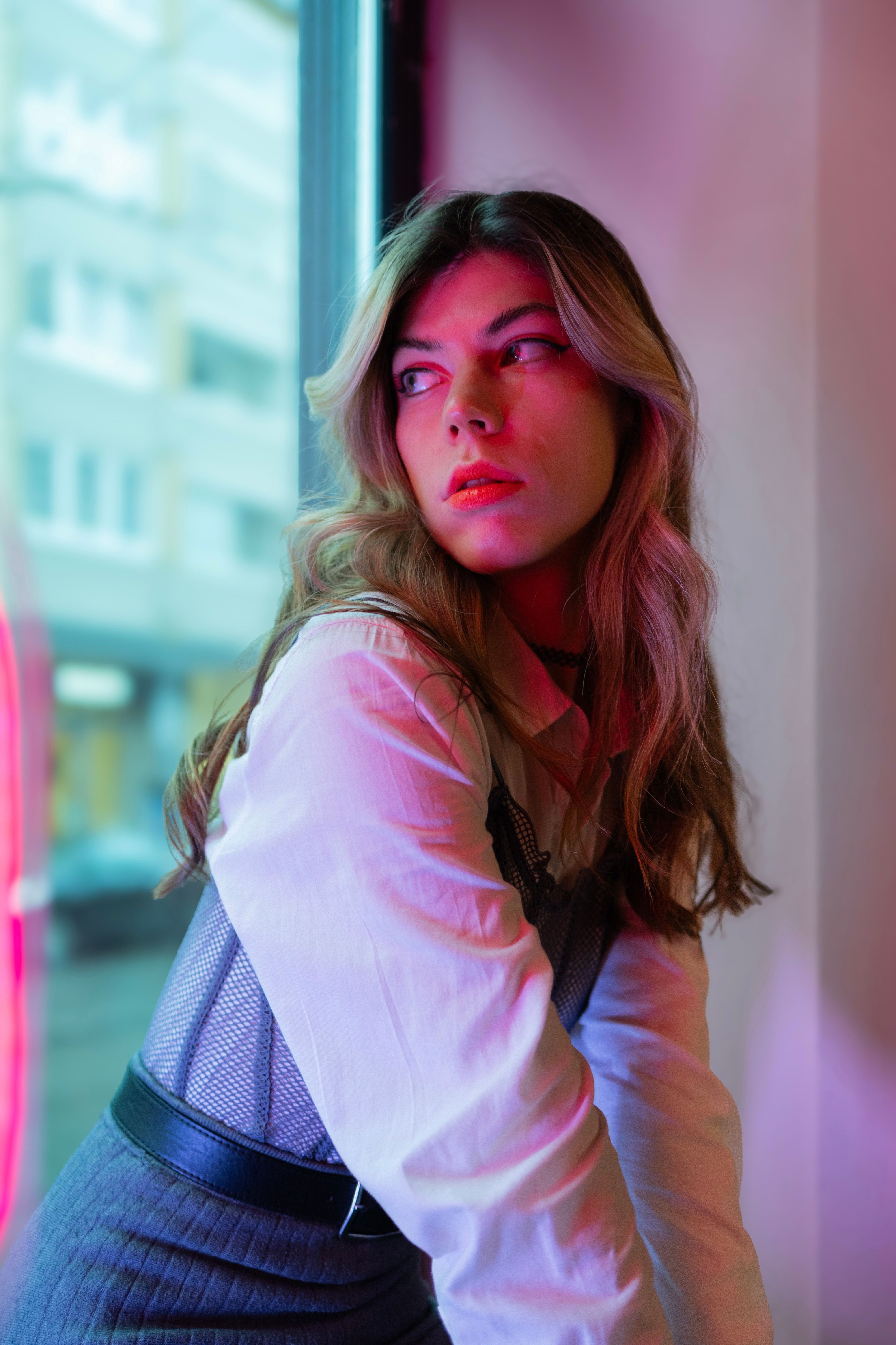 Blonde Woman in White Shirt Posing by Window · Free Stock Photo