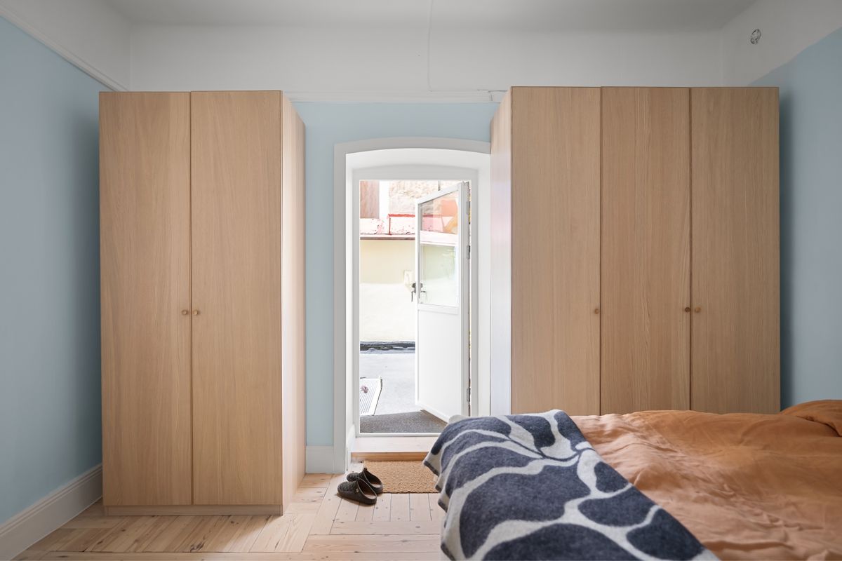 Bedroom with customized wooden cabinets and furniture