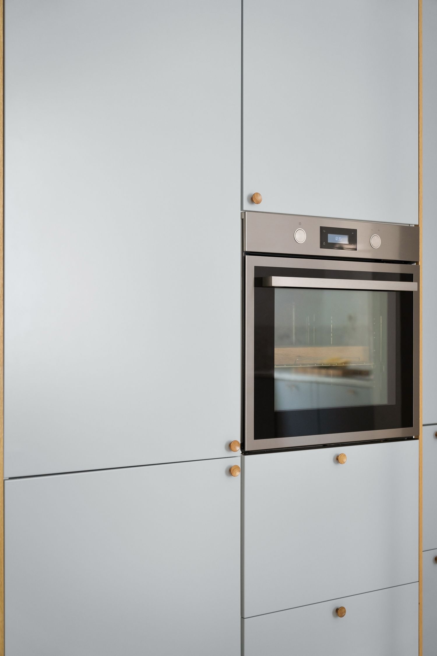 Built-in stainless steel oven in a modern kitchen