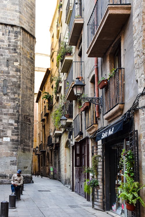 View of an Alley and Apartment Buildings in Barcelona, Spain 