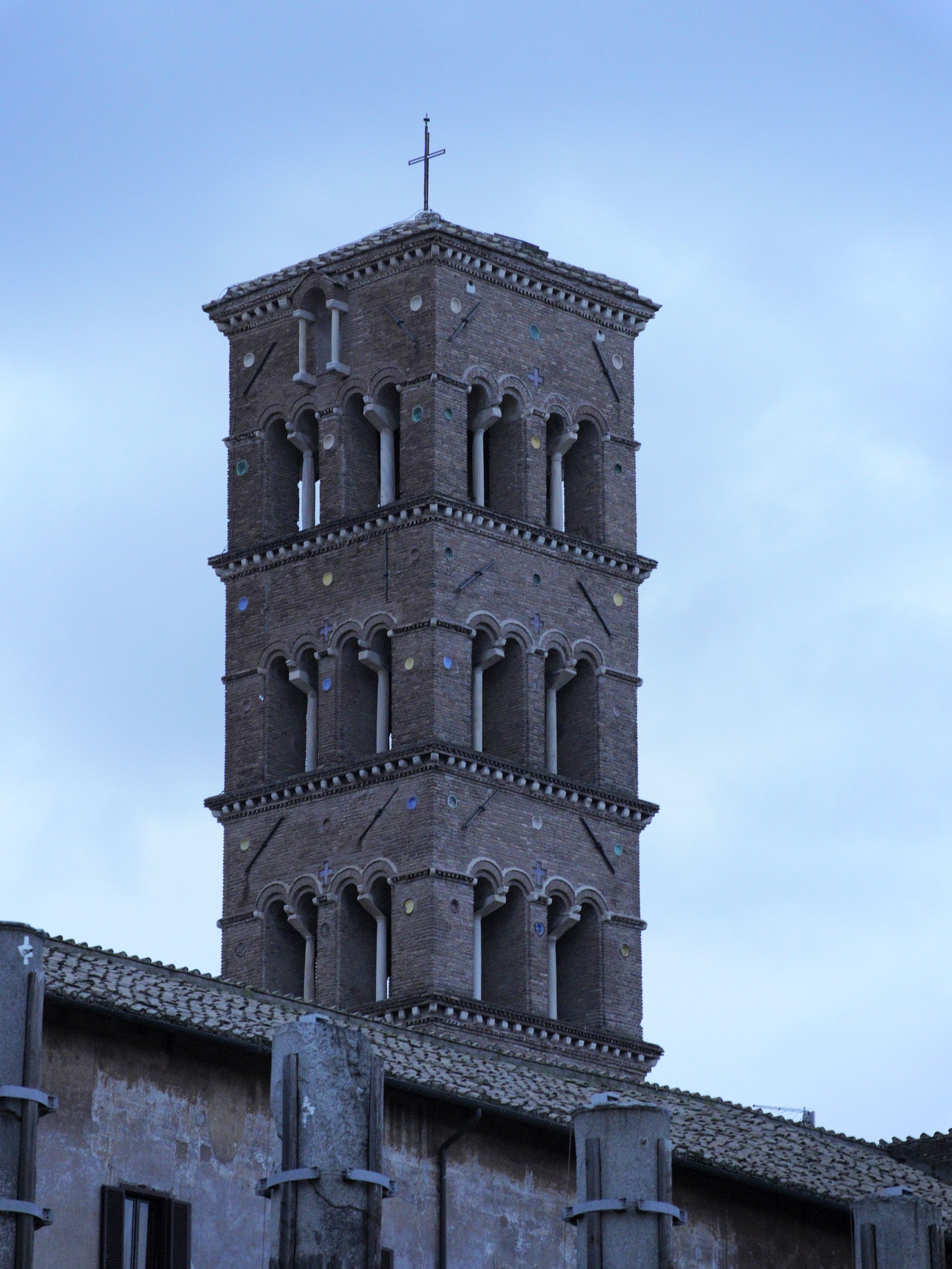 Elevated view of Santa Francesca Romana's brick tower in Rome, Italy.
