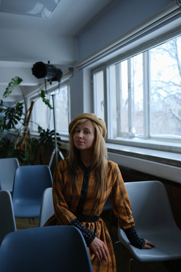 Blonde Woman Sitting On Chair