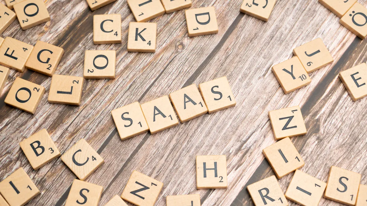 SaaS Pricing Models Explained for Buyers Comparing New Tools SaaS Pricing Models Explained for Buyers Comparing New Tools — Scrabble letters spelling saas on a wooden table