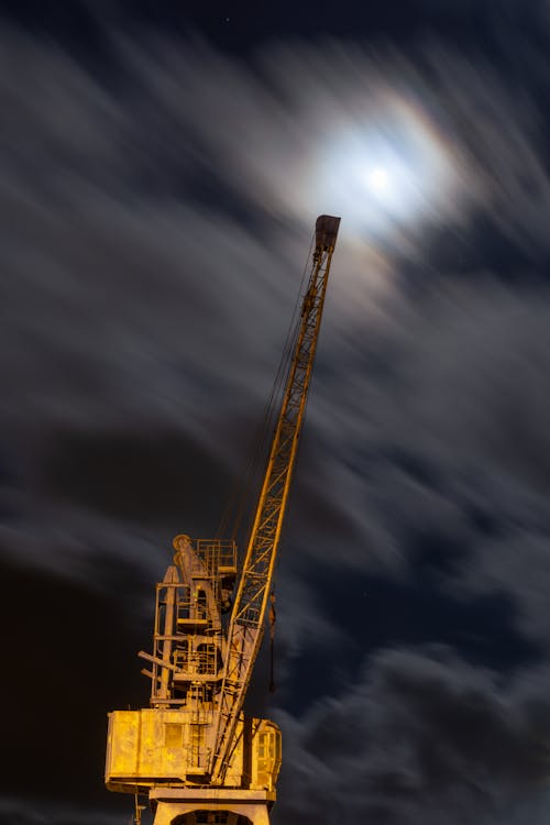 Crane Illuminated by Yellow Light at Night