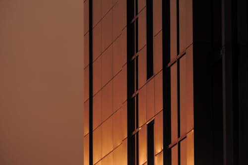 Setting Red Sun on Skyscraper Facade