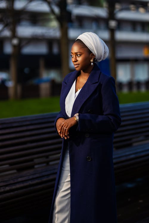 Woman in White Headscarf and Blue Coat