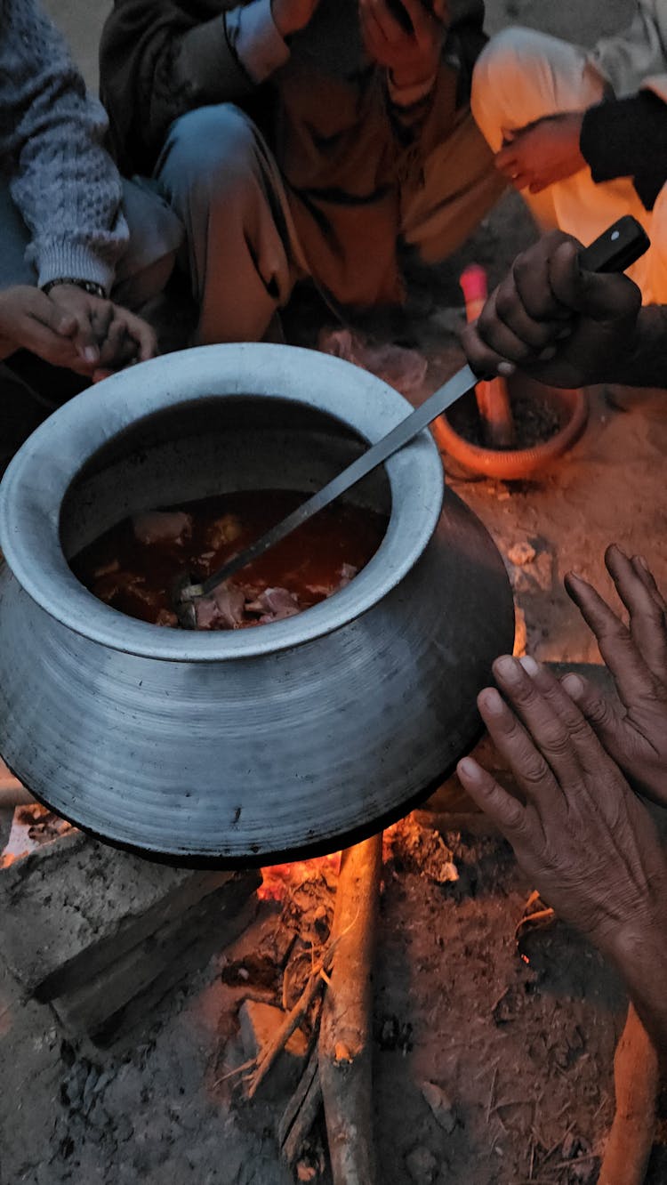 Cooking Stew In Bonfire