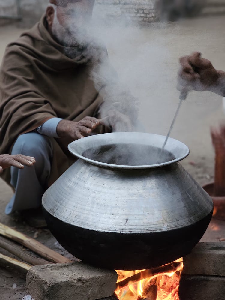 Steam Over Silver Pot On Bonfire