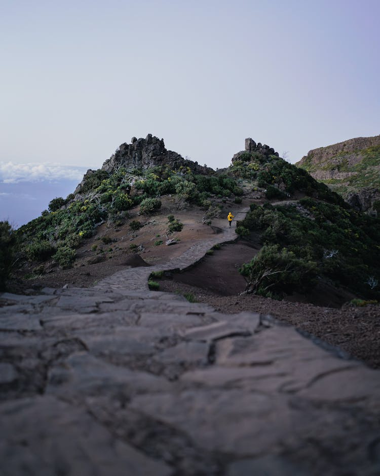 Person Hiking On Mountain Path