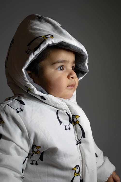 Child in White Jacket with Hood