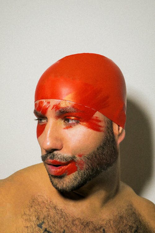 Portrait of Man with Red Paint on Head 