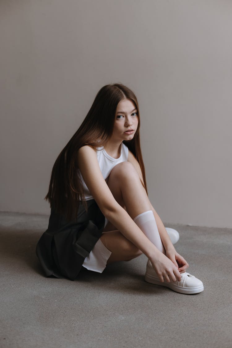 Teenage Model In Dress And Sneakers