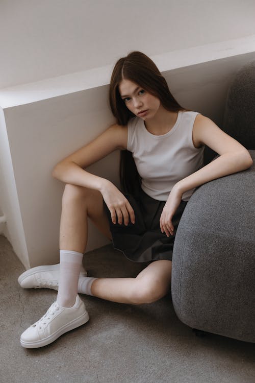 Woman Sitting near Couch