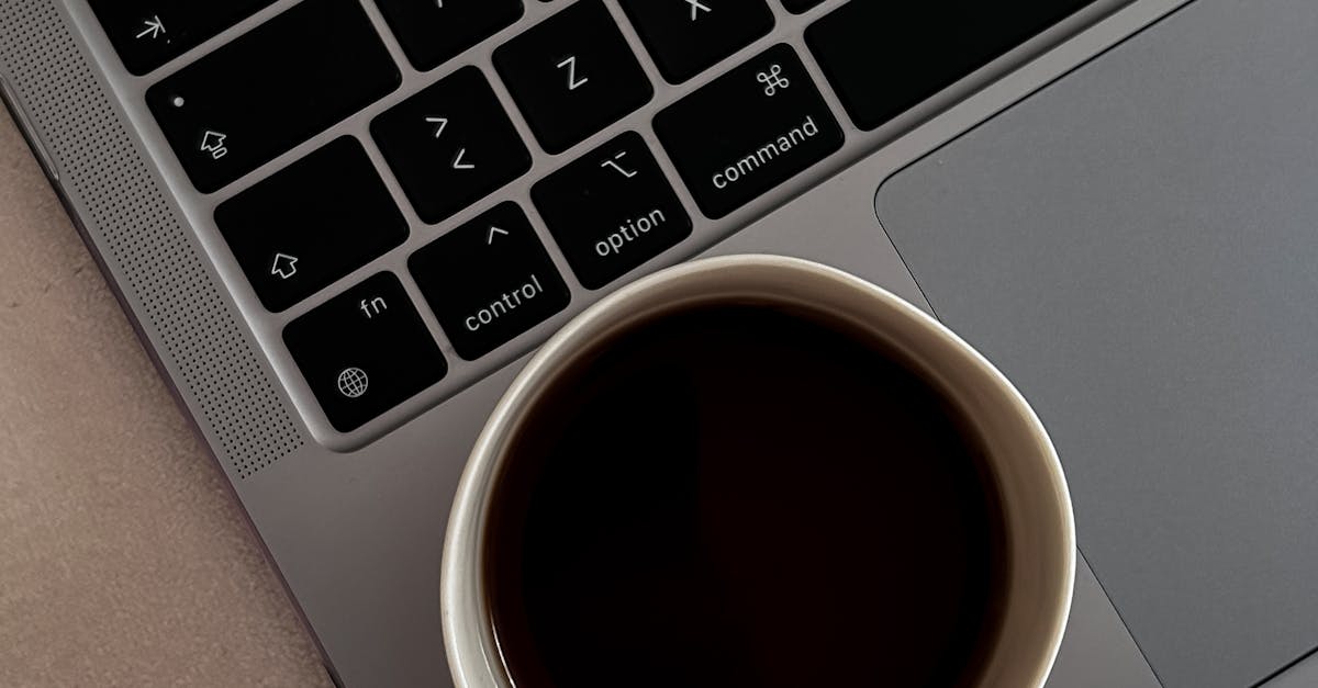 Cup of Coffee on Laptop · Free Stock Photo