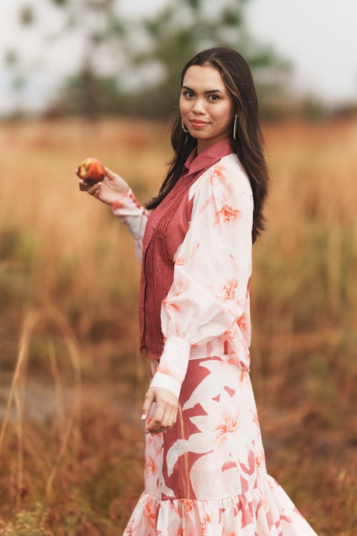 Brunette in Blouse and Skirt Posing in Rural Scenery