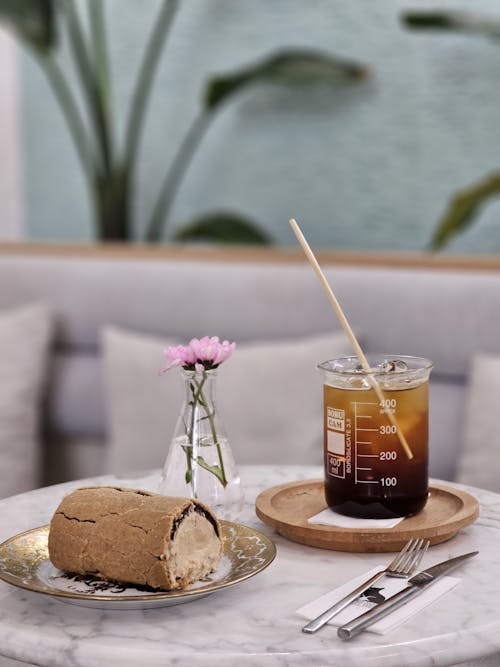 Beverage and Cake on Table