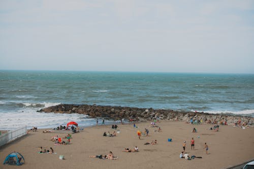 People on Beach on Sea Coast