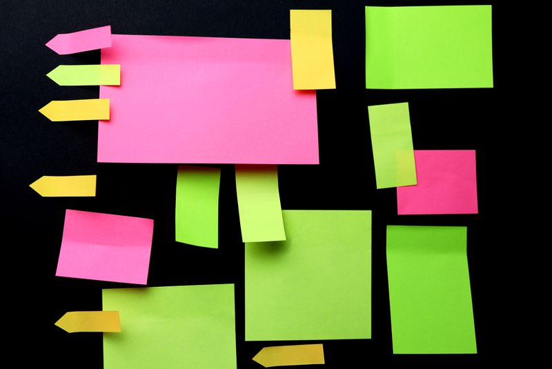 sticky notes arranged vertically like a ladder of priorities