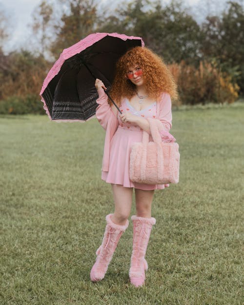 Red-haired Model Wearing Pink with Sun Umbrella