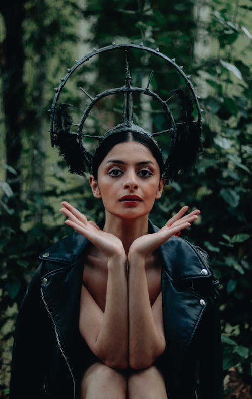 Model Posing in Leather Jacket and Headdress