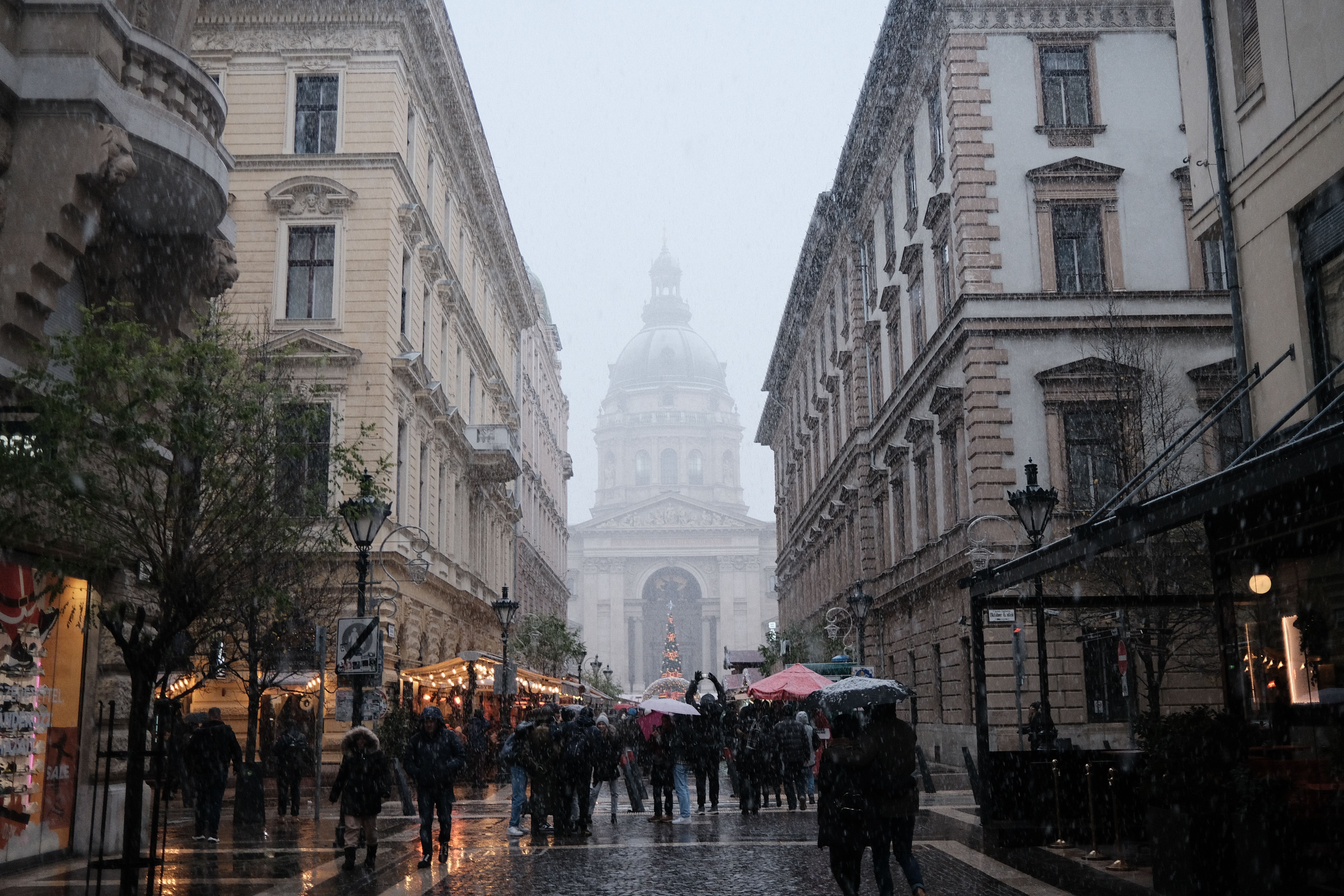Fashionable shoppers walking along Deák Ferenc utca, also known as Fashion Street, in Budapest, Hungary.