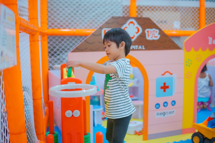 Child Playing In Kindergarten