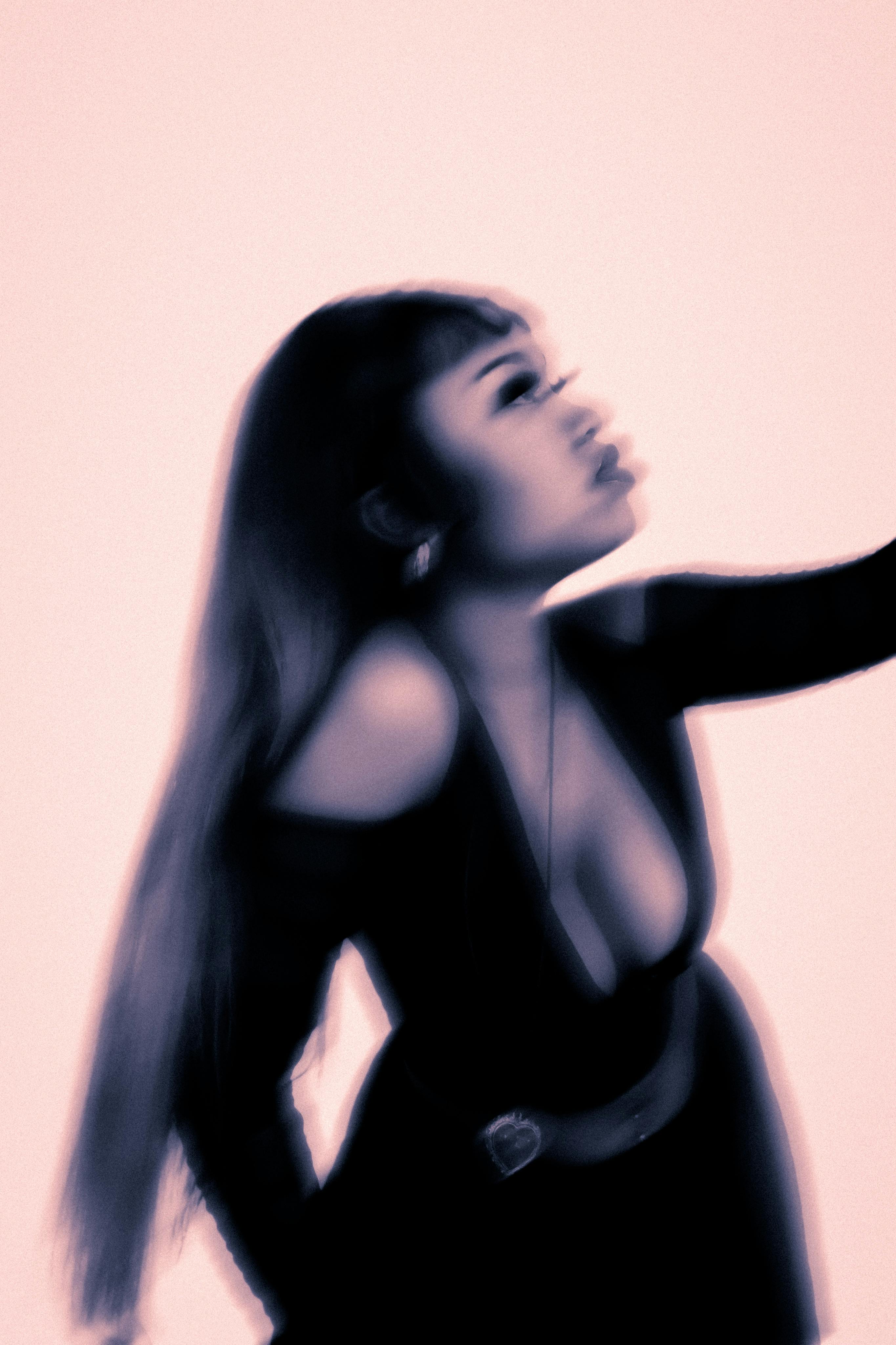 Artistic photograph of a woman in motion with a blurred effect. Fashionable and dynamic.