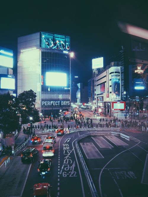 Free A vibrant aerial view of bustling Shibuya Crossing in Tokyo at night, showcasing city lights and urban energy. Stock Photo