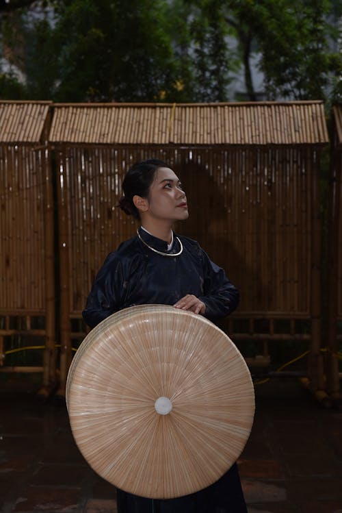 Woman Standing with Traditional Hat