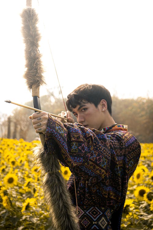 Traditional Archer in Sunflower Field