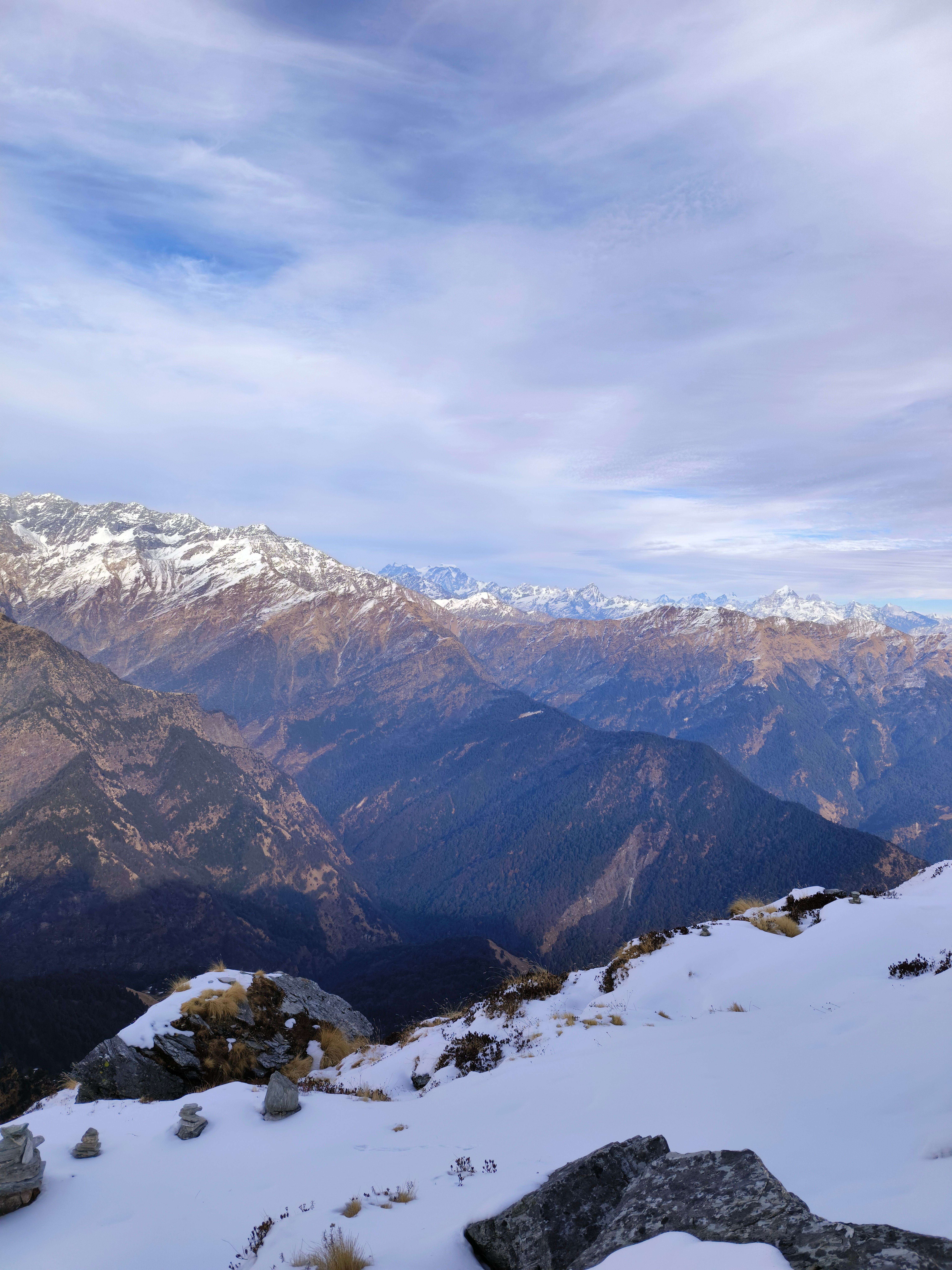 Stunning winter panorama of snow-capped Himalayan peaks from Tungnath, India.