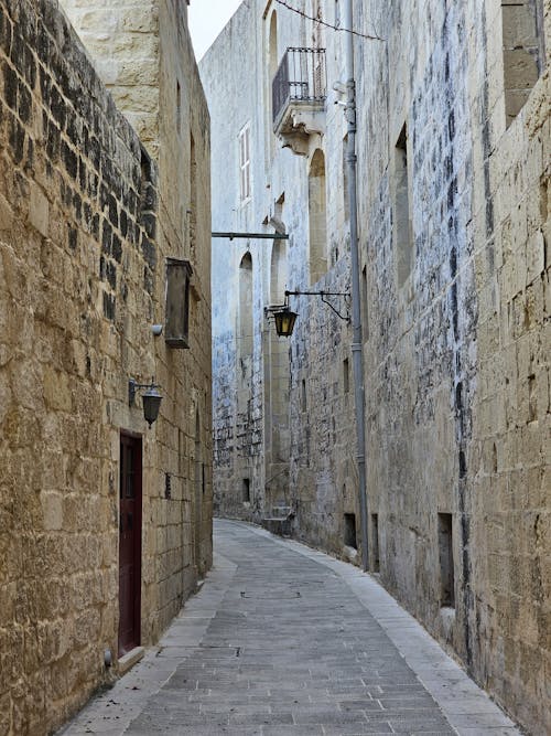 A Narrow Alley Between Stone Buildings