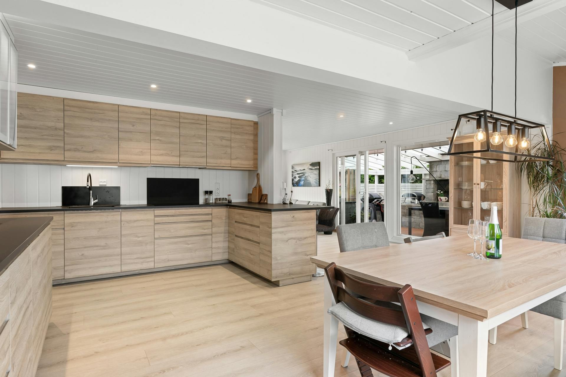 Spacious Kitchen and a Dining Room with Wood Furniture