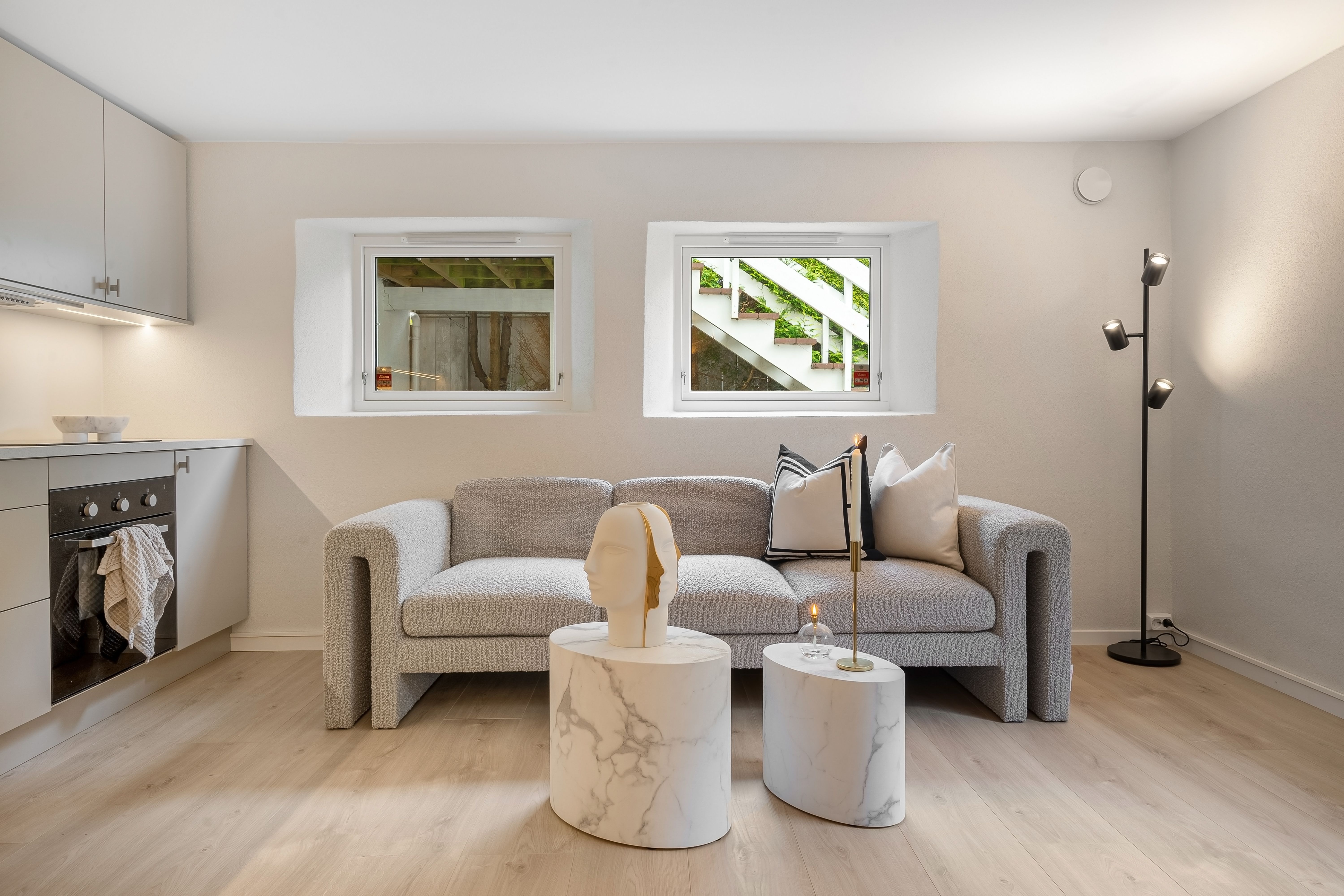 Explore this sleek and modern living room featuring a stylish sofa and minimalist decor. - High Quality Performance Evaluation