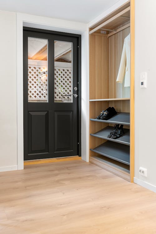 Black Door by Closet in Entrance to Apartment