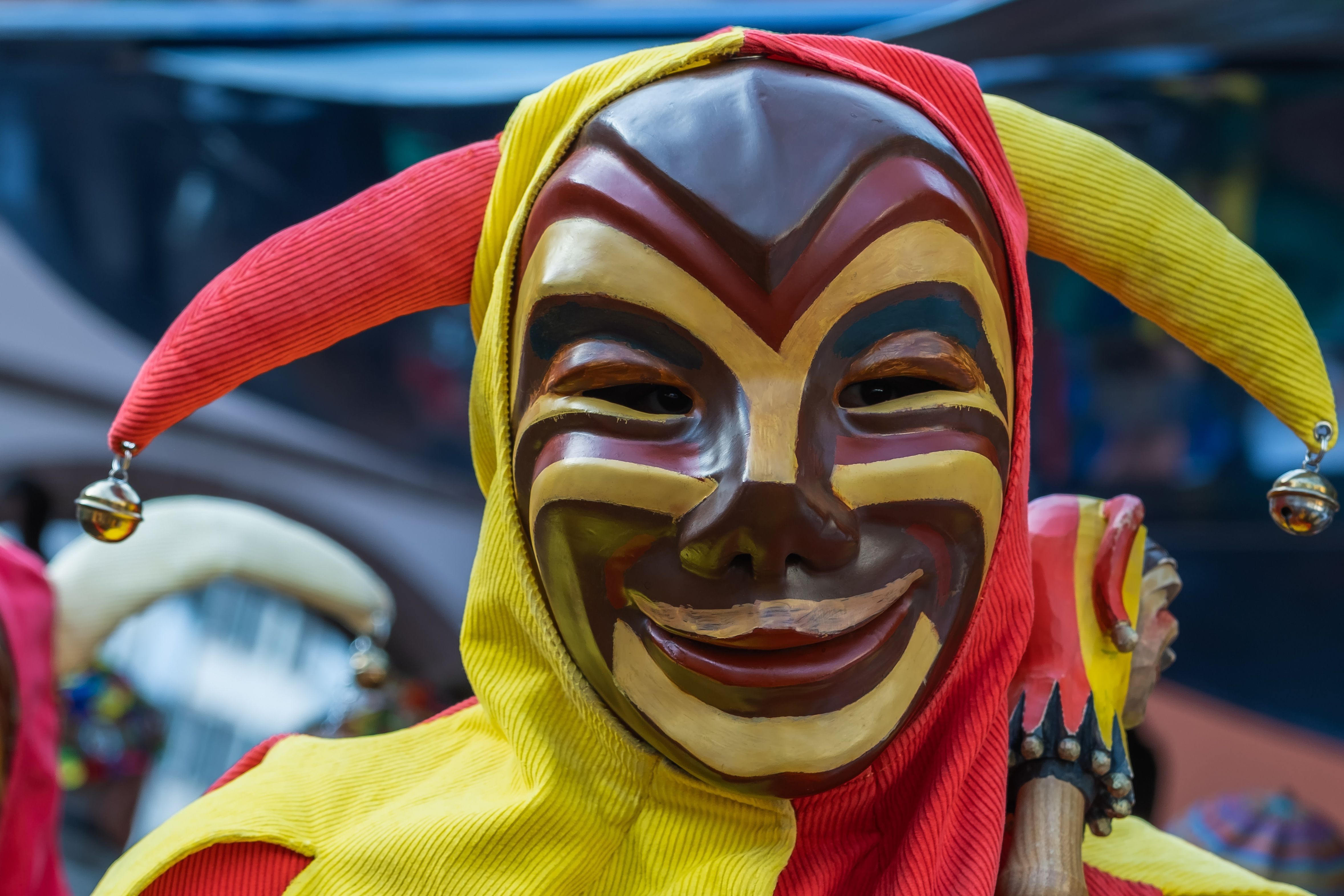 Vibrant clown mask at a traditional carnival festival in Freiburg, Germany.