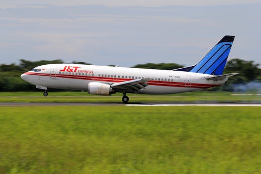 A commercial airplane taking off from an airport runway, showcasing transportation.