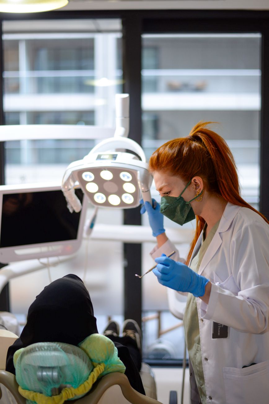 professional portrait of woman dentist smiling