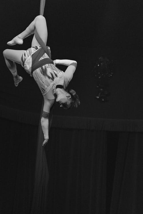 Black and White Photo of a Woman Aerial Dancing 