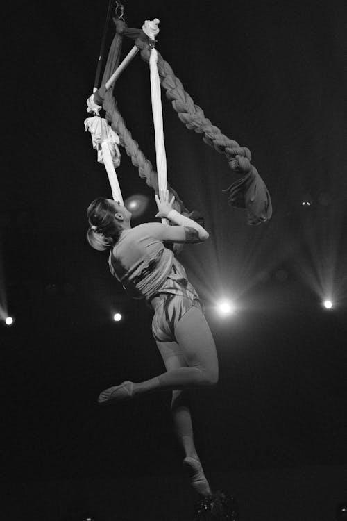 Black and White Photo of a Woman Aerial Dancing 