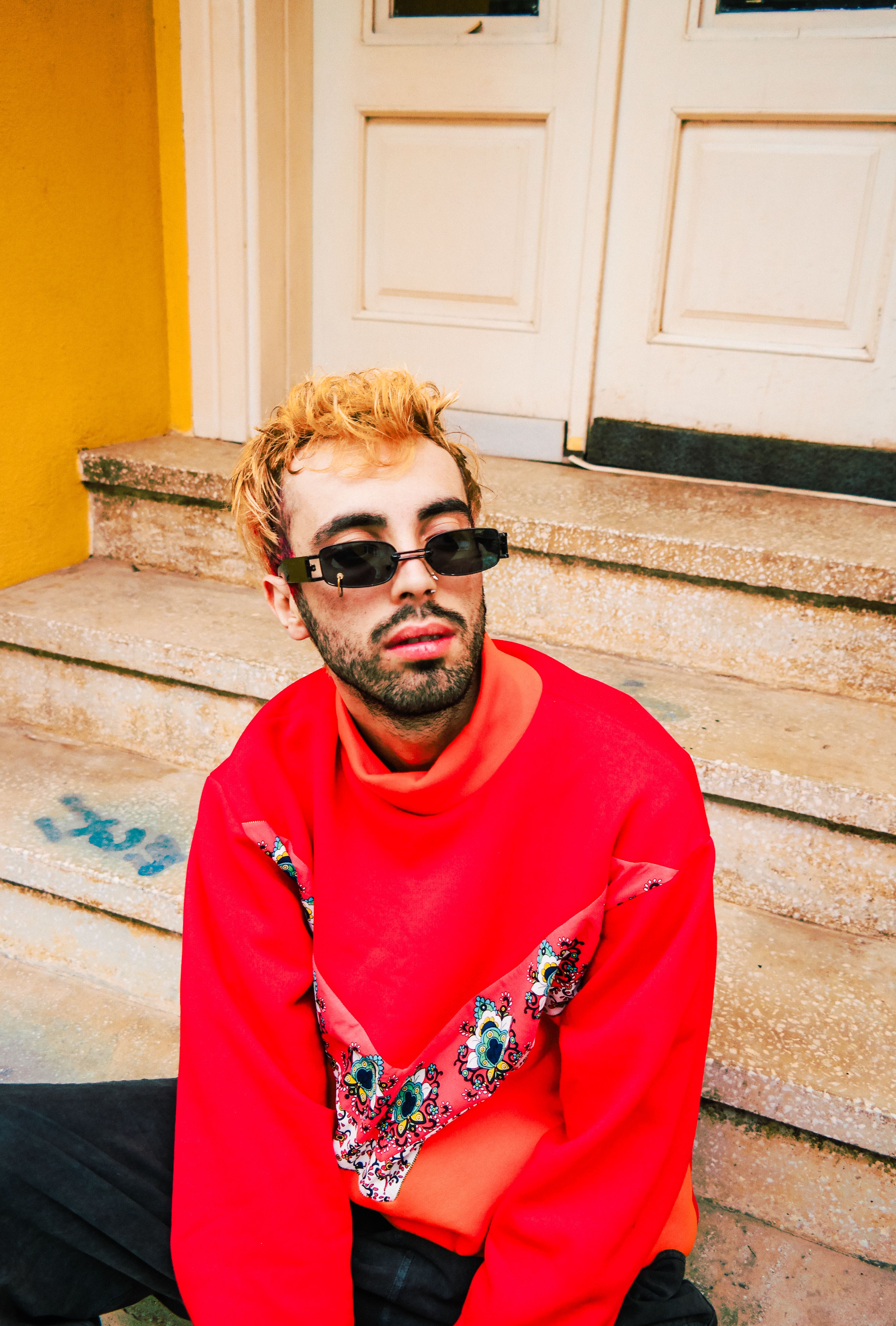 Man in Red Sweater and Sunglasses Sitting on a House Stoop · Free Stock ...