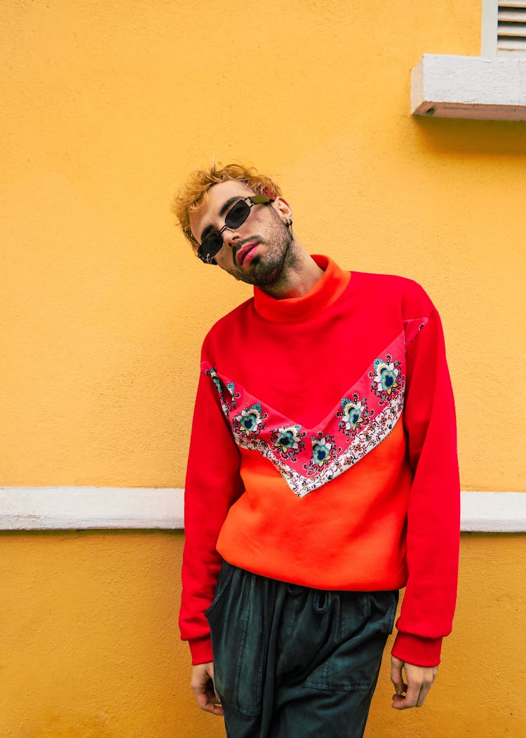 Man Posing In Orange Sweater 