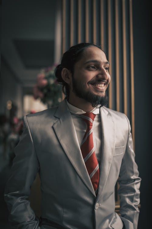 A man in a suit and tie smiling