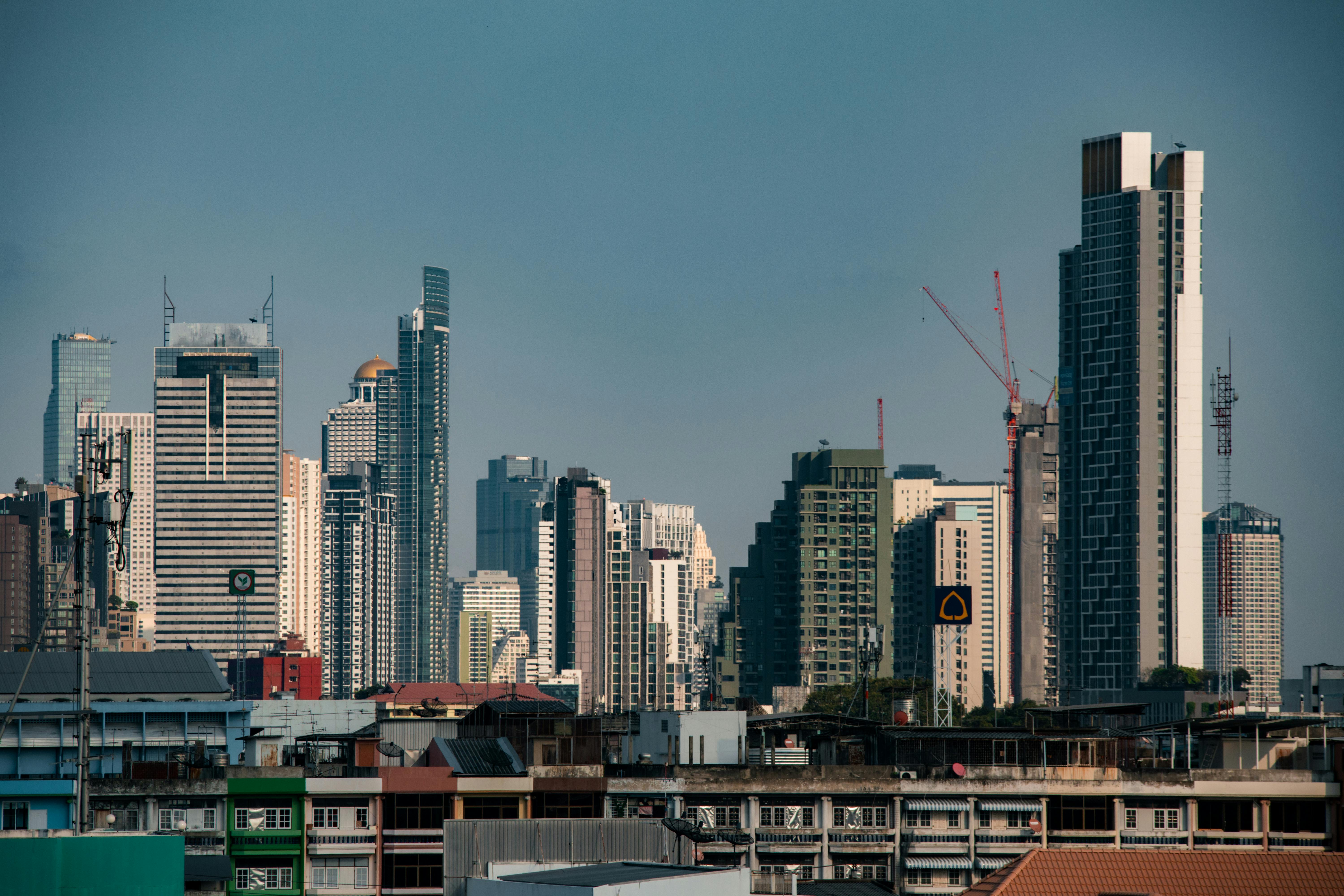 Stunning view of Bangkok's modern skyscrapers under a clear blue sky, perfect for travel inspiration.